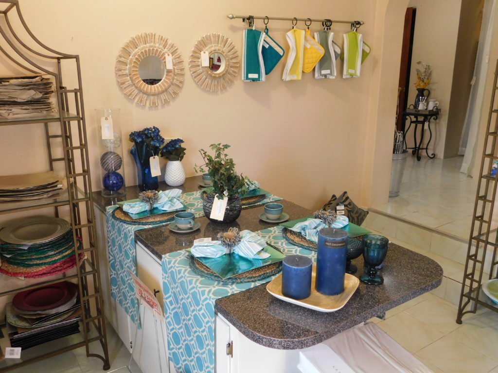 showing the kitchen layout at R&R with sea green and blue decor