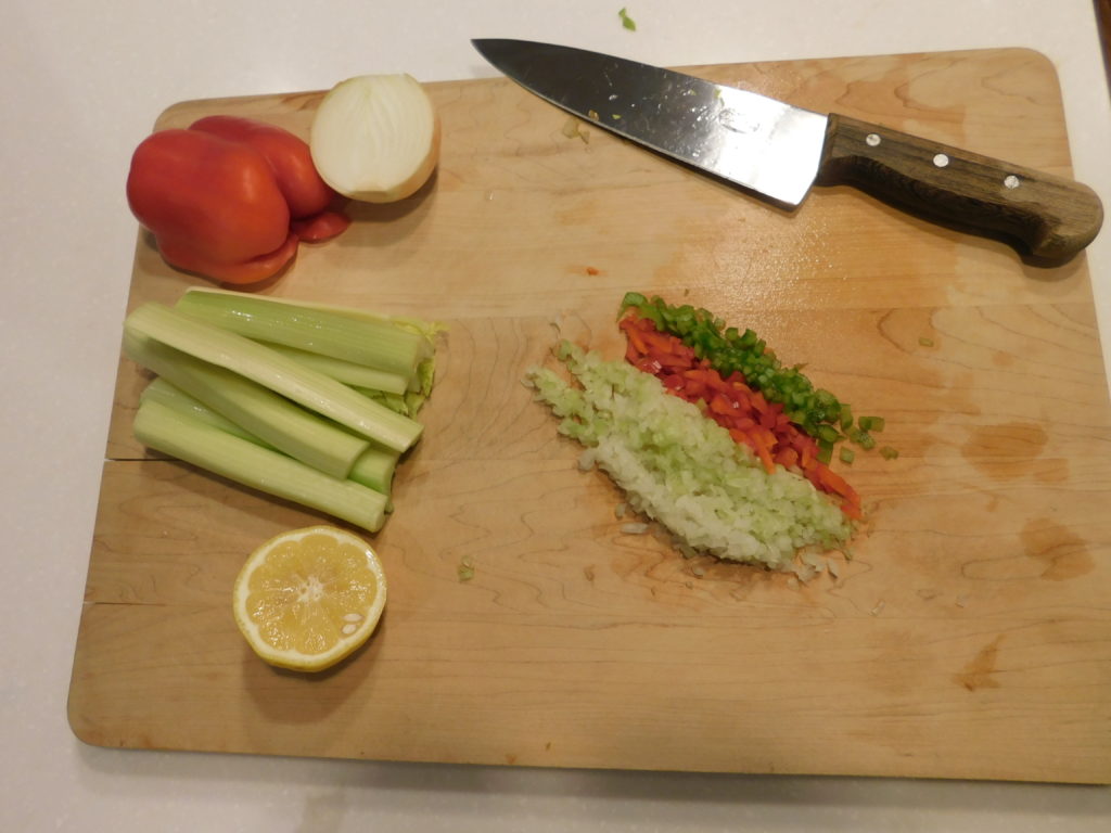 cutting board with diced, onion, celery, peppers