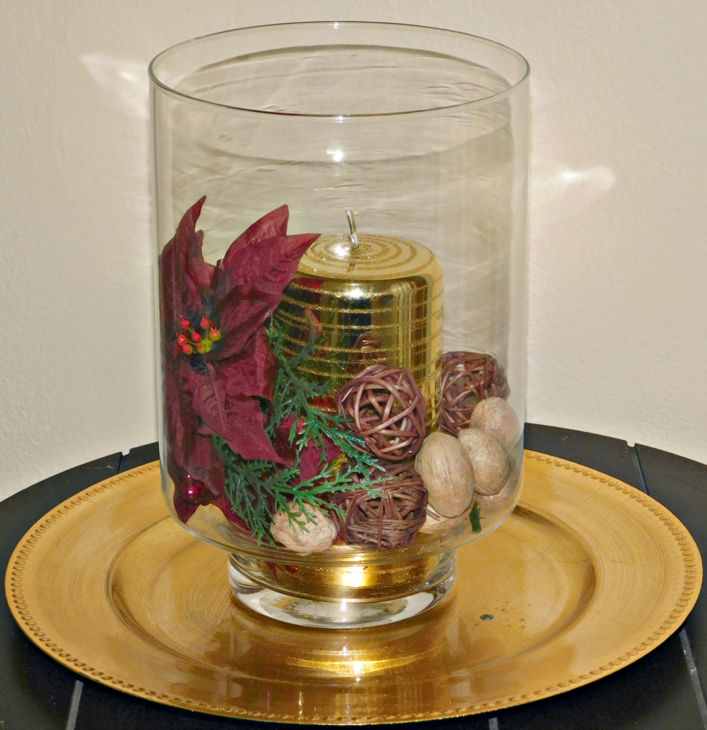 open vase with gold candle, faux flowers and fillers