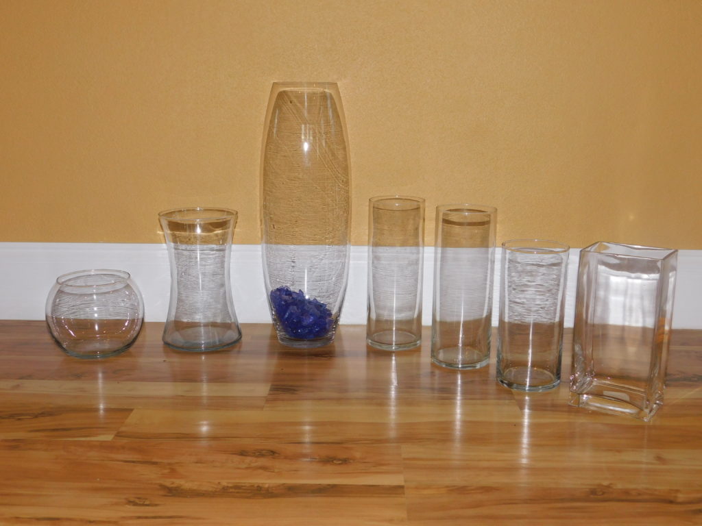 7 different size and shape vases