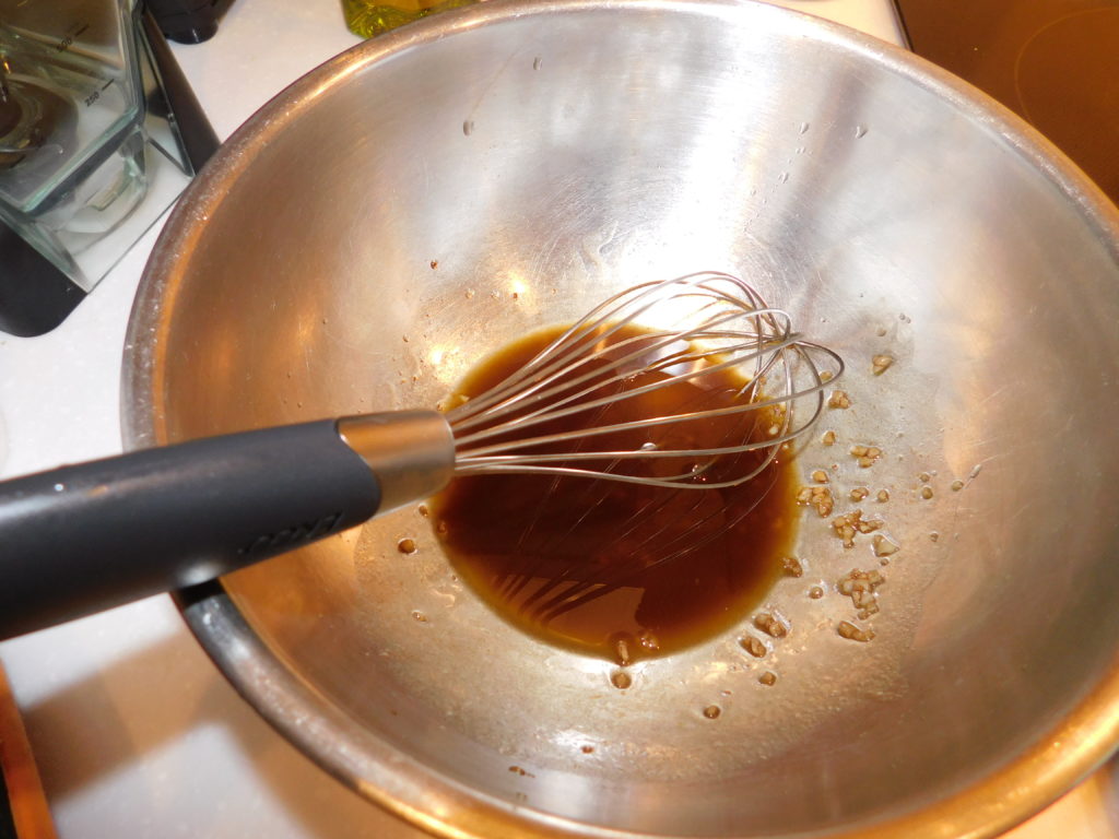 stainless steel bowl with olive oil mixture.