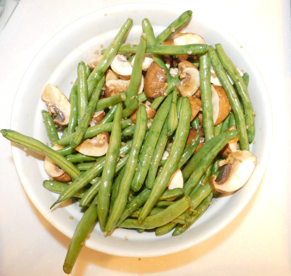 yellow bowl filled with green beans and mushrooms