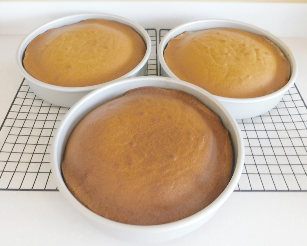 three nine inch round layer cake pans, baked pumpkin cake